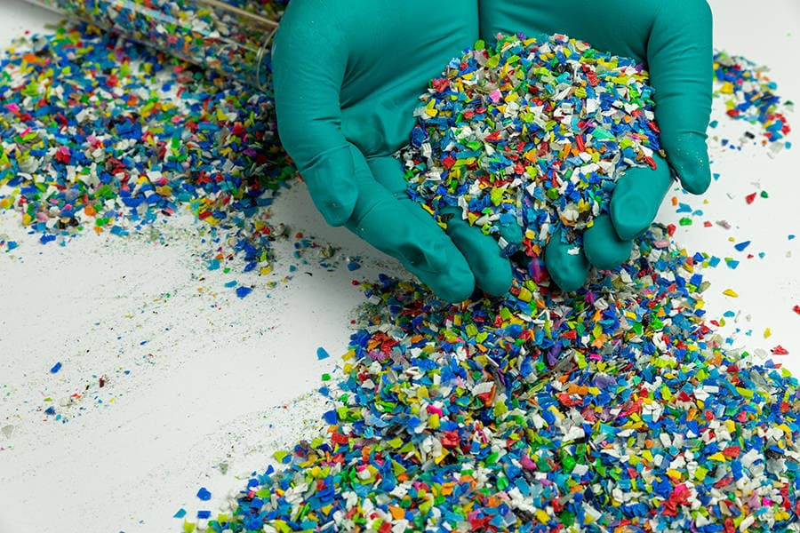 Recycled plastic pellets — post-consumer material ready for reprocessing